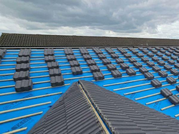 New tiled roof being installed